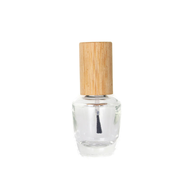 Klare leere Nagellackflasche aus Glas mit Bambusdeckel