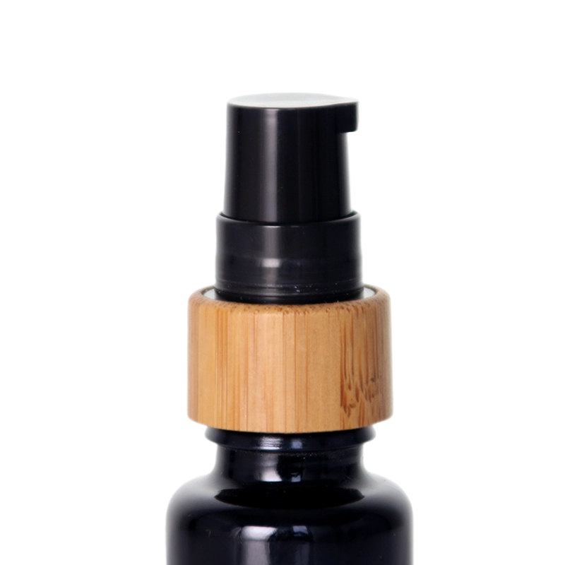 Schwarze Bambus-Pumpglasflasche mit ätherischen Ölen