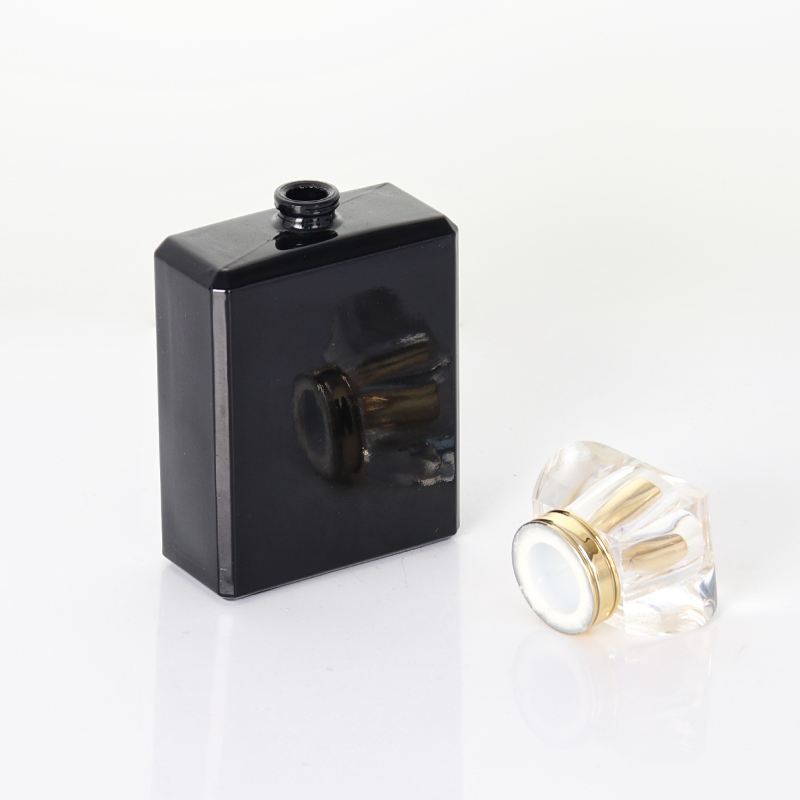 Elegante schwarz-goldene Parfümflasche aus Kölner Sprühglas